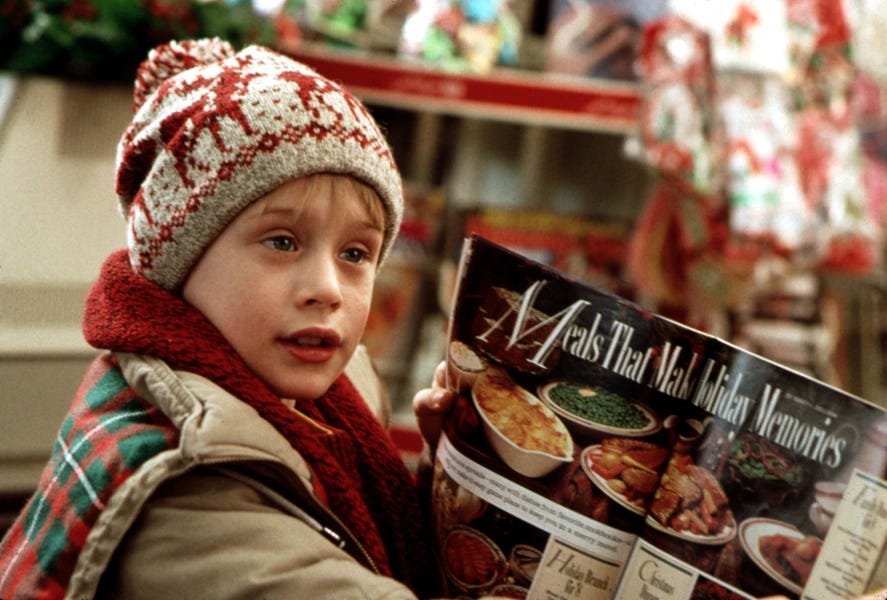 Kevin McCallister in Home Alone holding up a magazine with recipes