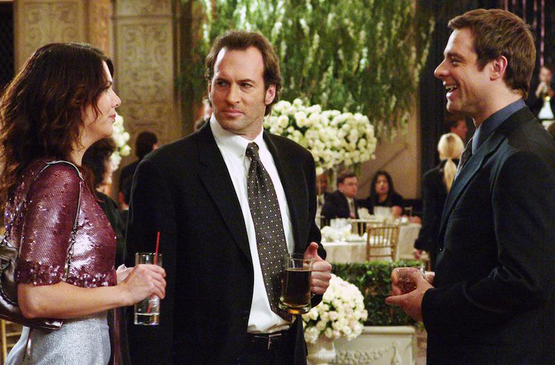 Lorelai Gilmore, Luke Danes, and Christopher at a wedding in Gilmore girls